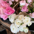 Load image into Gallery viewer, Bouquets of pink and white RANUNCULUS flowers on a wooden surface